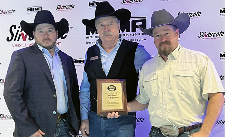 S-5!'s Dustin Haddock, S-5! CEO Rob Haddock and Shawn Haddock accept the accepted the Gold Level Industry Advocate Award from the Metal Building Manufacturers Association. 